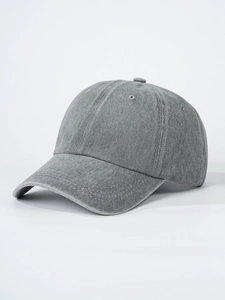 Detail view of the washed cotton fabric texture and stitching on a charcoal baseball cap