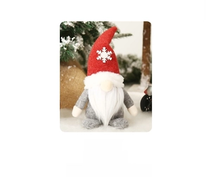 Close-up of a Christmas gnome doll with a red snowflake hat and size specifications