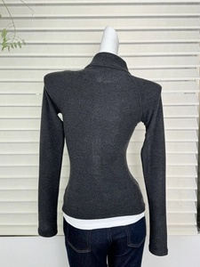 Back view of slim fit dark grey thermal knit top with high neck and long sleeves