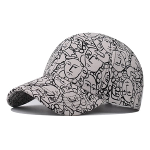 Grey cotton baseball cap featuring black abstract face doodle art in a street fashion style