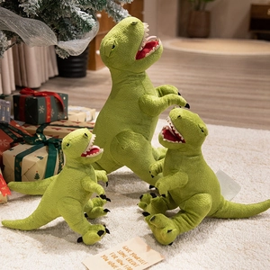 Three-piece green T-Rex plush dinosaur toy set in various sizes on soft white rug