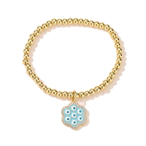 18K gold plated beaded bracelet featuring a floral evil eye charm with blue enamel stones