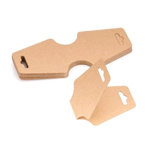 Macro view of brown kraft paper jewelry display cards with folding and hanging hole detail