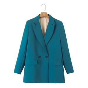 Detailed front view of women's teal double-breasted blazer with notched lapels and pockets