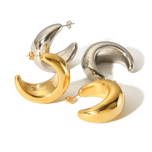 Oversized gold and silver C-shaped crescent hoop earrings in polished stainless steel
