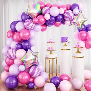 Pink and purple balloon arch kit with holographic star balloons and elegant cake stands
