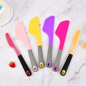 Set of 6 colorful silicone spatulas for baking and mixing on marble background