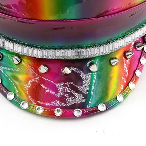 Macro shot of rainbow laser leather hat with silver rivets and rhinestone embellishments