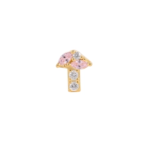 Macro detail of gold mushroom earring featuring pink marquise gems and white zircons