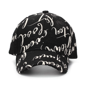 Black distressed baseball cap with white script lettering and street style ripped details