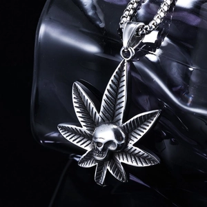 Polished stainless steel skull and maple leaf pendant necklace with vintage silver finish