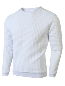 Detailed close-up of white waffle texture knit fabric on a men's crewneck sweatshirt