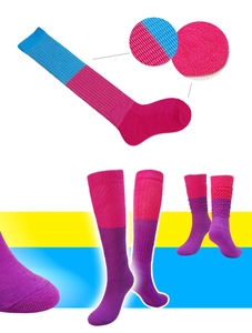 Detailed knit texture of colorful slouch socks in blue, magenta and purple contrast