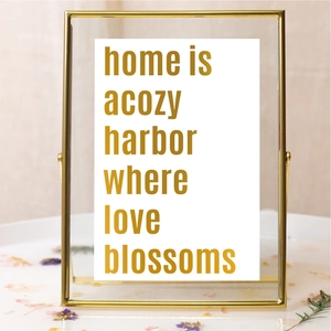 Detail of 2-inch gold metal frame with double-sided glass and decorative art card inside