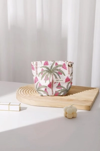 Detailed view of watermelon palm tree embroidery on fabric makeup bag with floral zipper