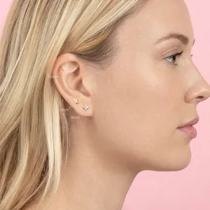 Elegant 925 sterling silver flower stud earrings set with white cubic zirconia in gold