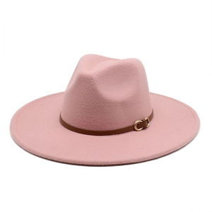 Detailed close-up of a pink wool fedora hat featuring a brown leather belt with gold buckle