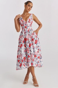 Detail of V-neck sleeveless floral midi dress in white with vibrant red and pink flowers