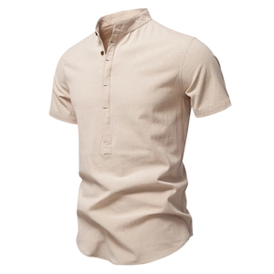 Detail of men's beige cotton linen shirt with mandarin collar and textured fabric
