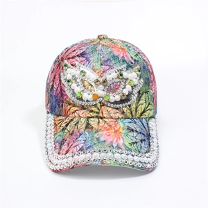 Detailed view of colorful printed baseball cap with pearls and sparkling rhinestones