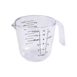 Clear plastic 300ml measuring cup with oz, ml and cup scales on white background