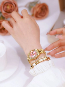 Elegant gold watch for women with a pink diamond-set dial and matching gold bracelets