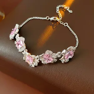 Elegant silver bracelet with pink zircon floral charms and rectangle gemstones