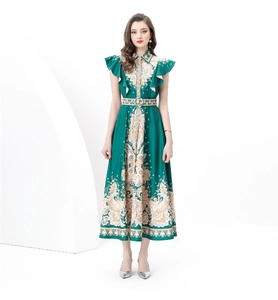 Detailed view of the dark green baroque print on a flared maxi dress with ruffles