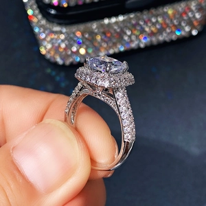 Macro side view of square cut zircon ring with double halo and pavé split shank band