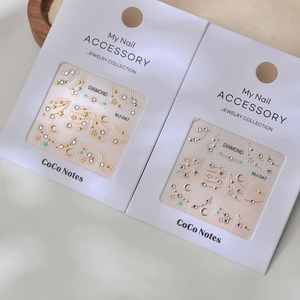 French style nail art stickers with gold stars, moon designs and sparkling K9 crystals