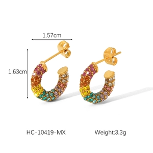 Macro detail of gold C-shaped earrings with colorful rhinestones and size measurements