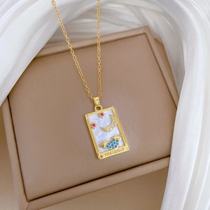 Detail of a tarot Moon necklace pendant with mother-of-pearl inlay and colored zircons