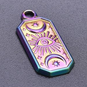 Macro detail of rainbow evil eye pendant with celestial stars and crescent moon