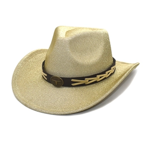 Detailed view of golden glitter cowboy hat featuring a leather band with a metal bull head