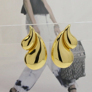 Chic 18K gold plated double teardrop brass earrings for women on display stand
