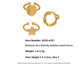 Detail view of gold stainless steel ring set with cubic zirconia in various geometric designs