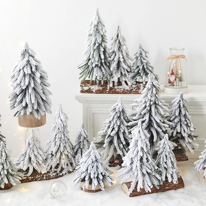 Mini PE snowy Christmas trees with wooden bases for festive tabletop home decoration