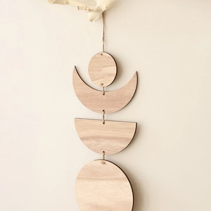 Bohemian style sun and moon wood wall hanging decor with natural jute rope on beige wall