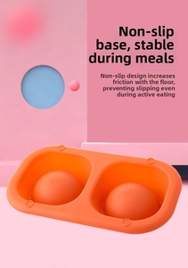 Detail of the non-slip base and slow feeder design of this orange double pet bowl