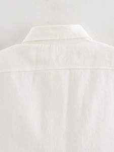 Close-up of premium white twill cotton texture on the back collar of the vest