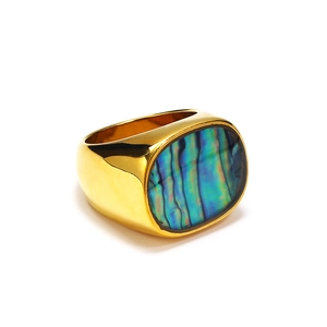 Macro detail of oval abalone shell inlay on wide gold-plated titanium steel ring