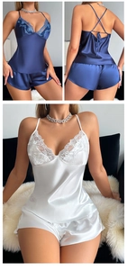 Detail of navy silk pajamas with lace trim and cross-strap back design for women