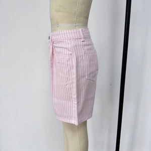 Detail view of pink and white striped high-waisted denim shorts featuring side pocket design