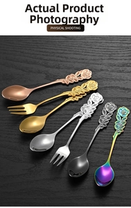 Macro shot of stainless steel spoons and forks featuring detailed rose flower handles