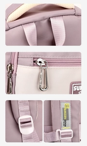 Detailed view of high-quality fabric, metal zippers and reinforced straps on purple backpack