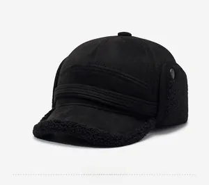 Detail of warm black trapper hat featuring faux suede fabric and thick fleece lining