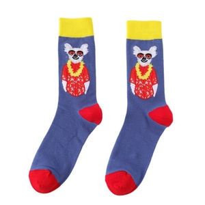 Detail of blue cotton crew socks featuring yellow cuffs and animal cartoon patterns