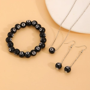 Detail of 8-ball jewelry set featuring beaded bracelet, necklace, and dangle earrings