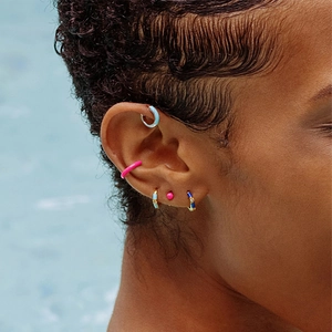 Close-up of S925 silver ear cuffs with blue and pink enamel and CZ diamond accents