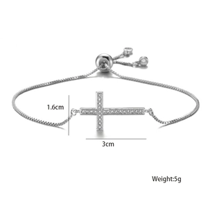 Macro detail of silver cross bracelet with AAA zircon pavé and adjustable bolo chain link